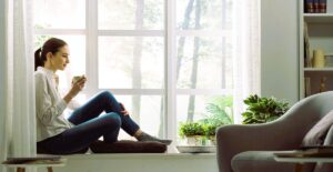 woman resting on the windowsill